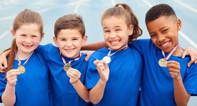 Sports day etiquette | Group of children with medals | Children's etiquette classes