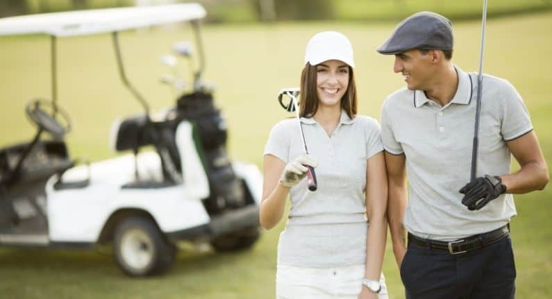 Golf etiquette | Man and Woman on golf course holding golf club